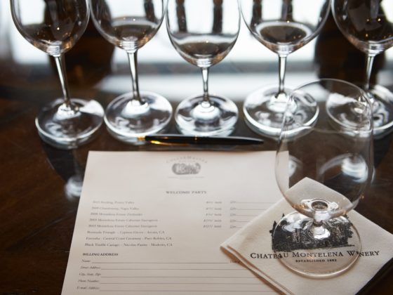 Place setting with wine glasses and menu